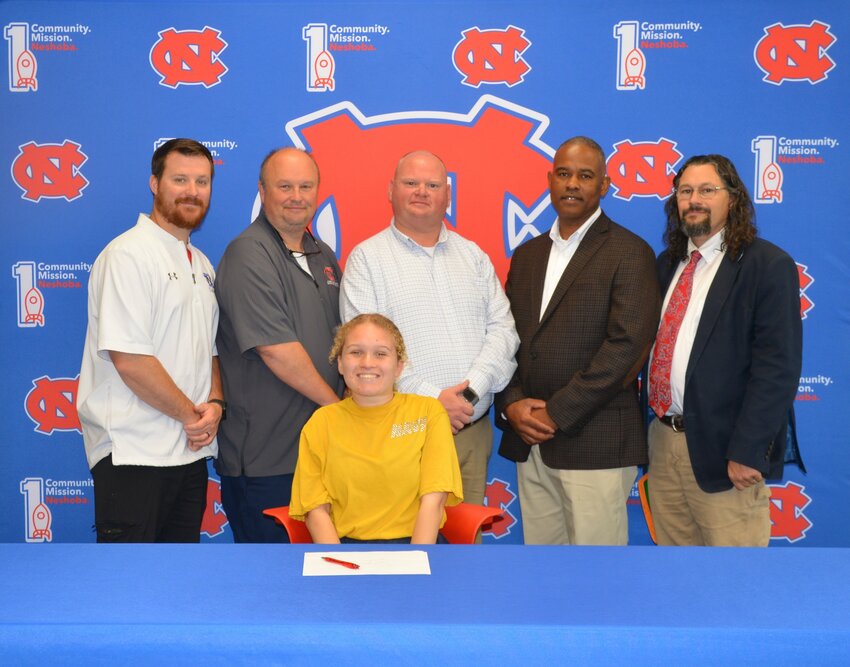 Neshoba Central’s Oliva Jones signed with the University of Southern Mississippi to further her education and be a member of the band. Pictured, are front, Olivia Jones (Back) Assistant Principal Jonathan Walker, Principal Jason Gentry, Assistant Principal Brent Pouncy Assistant Principal LaShon Horne, and Band Director Daniel Wade
